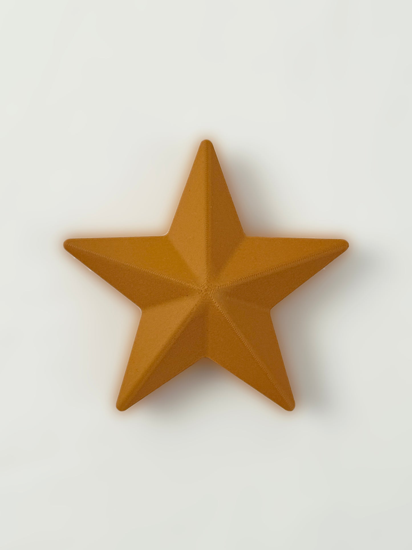 3D print Brown star Christmas ornament on a white background