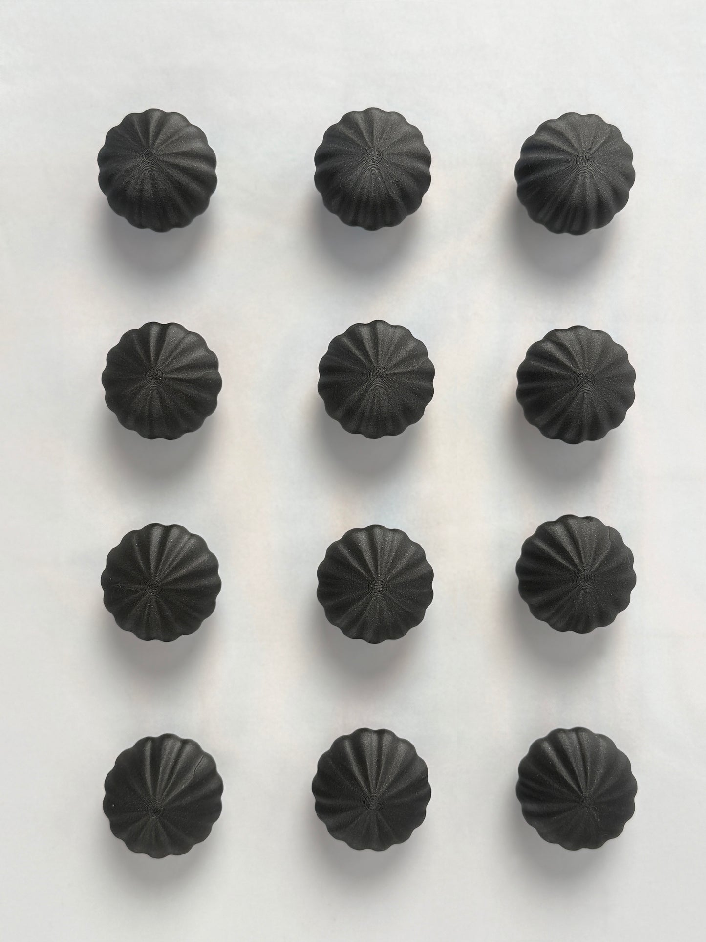 Black spherical shaped Christmas ornament