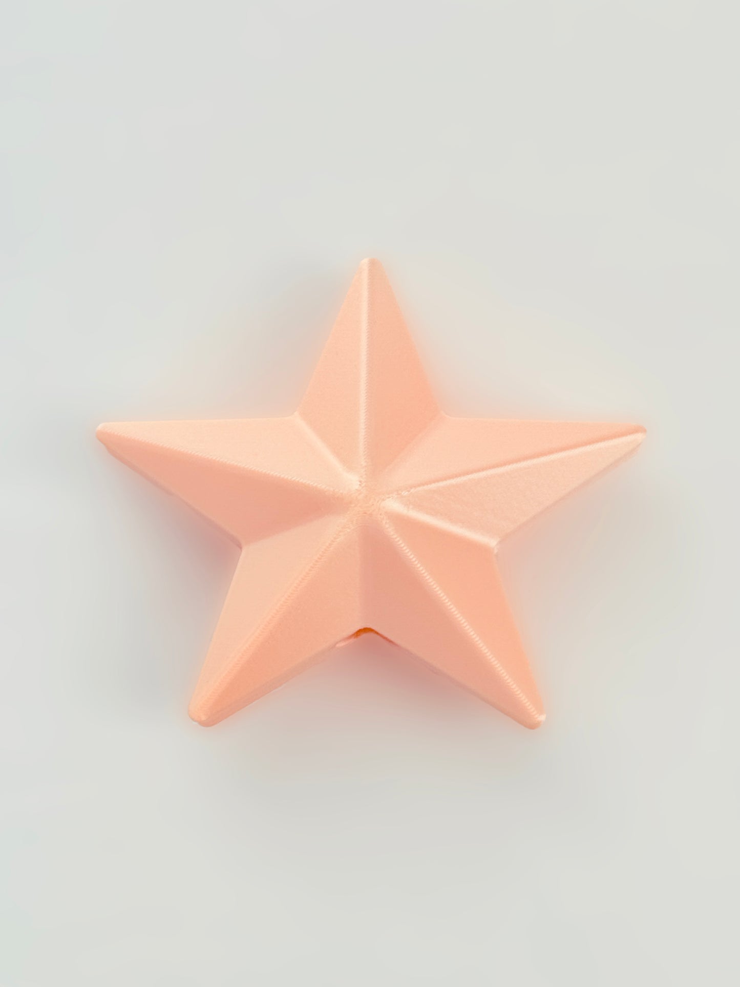 3D print Pink star Christmas ornaments on a light gray background