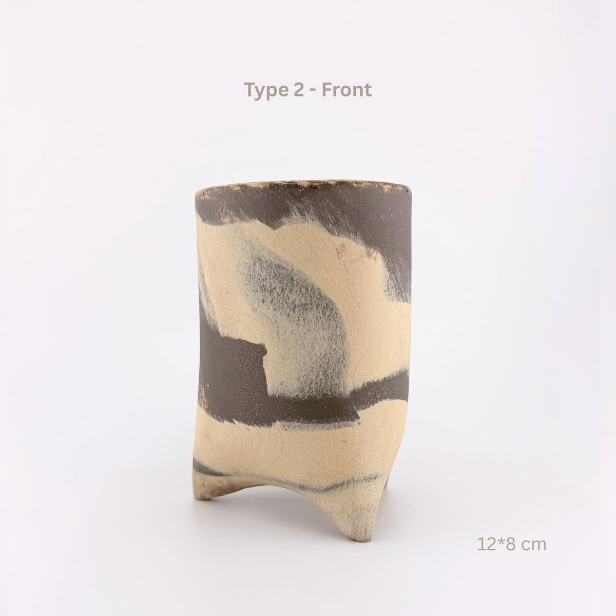 A handmade ceramic cup with a three-pronged footed base, featuring an abstract painted pattern in beige, brown, and gray. The image includes text overlays reading 'Type 2 - Front' and '12*8 cm' on a clean white background.