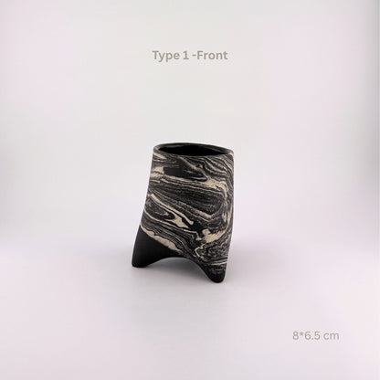 A modern sculptural ceramic vase with a black and white marbled pattern and a three-pronged base, shown on a light gray background with text overlays 'Type 1 -Front' and '8*6.5 cm'.