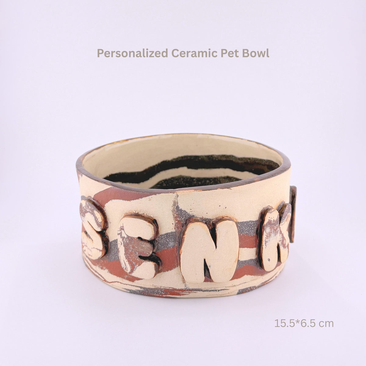A handmade ceramic pet bowl with raised lettering spelling 'SENK' on the front, shown on a plain light background with text overlays indicating 'Personalized Ceramic Pet Bowl' and dimensions '15.5*6.