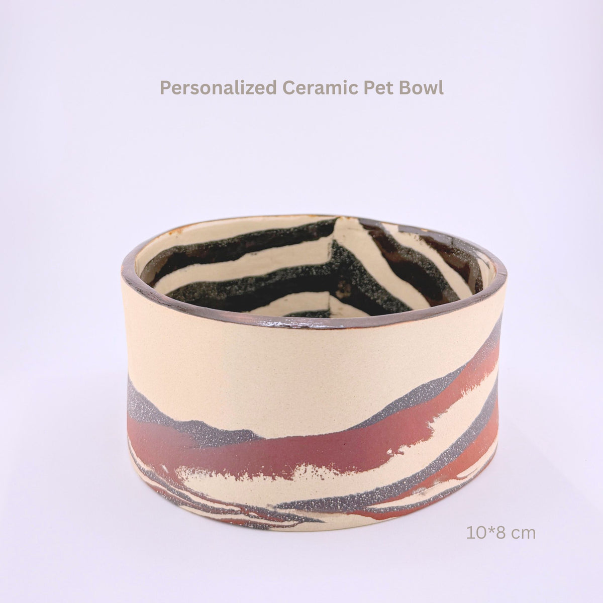 A cylindrical ceramic pet bowl with a zebra-like black and cream pattern on the interior and wavy bands of rust red, dark gray, and cream on the exterior. Text overlays read 'Personalized Ceramic Pet Bowl' and '10*8 cm'.