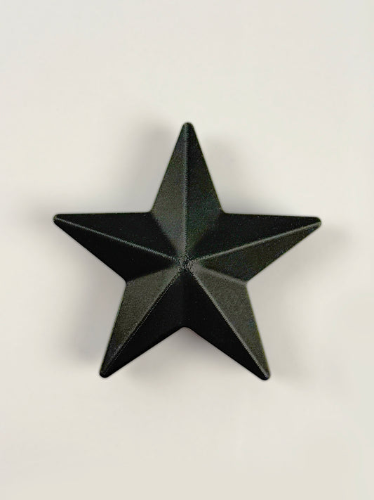 Black 3D print star object / ornament on a white background