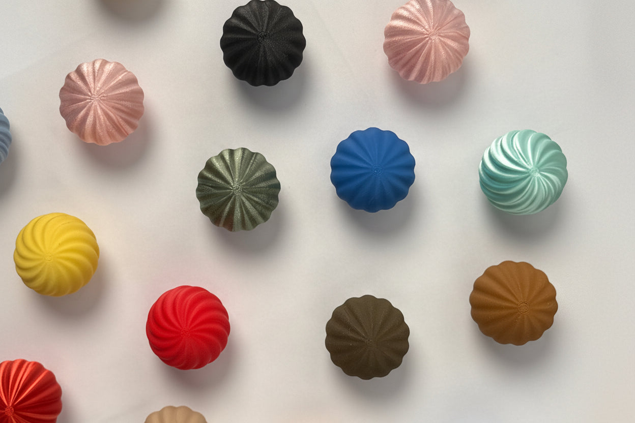 Assorted colorful candy buttons on a white background