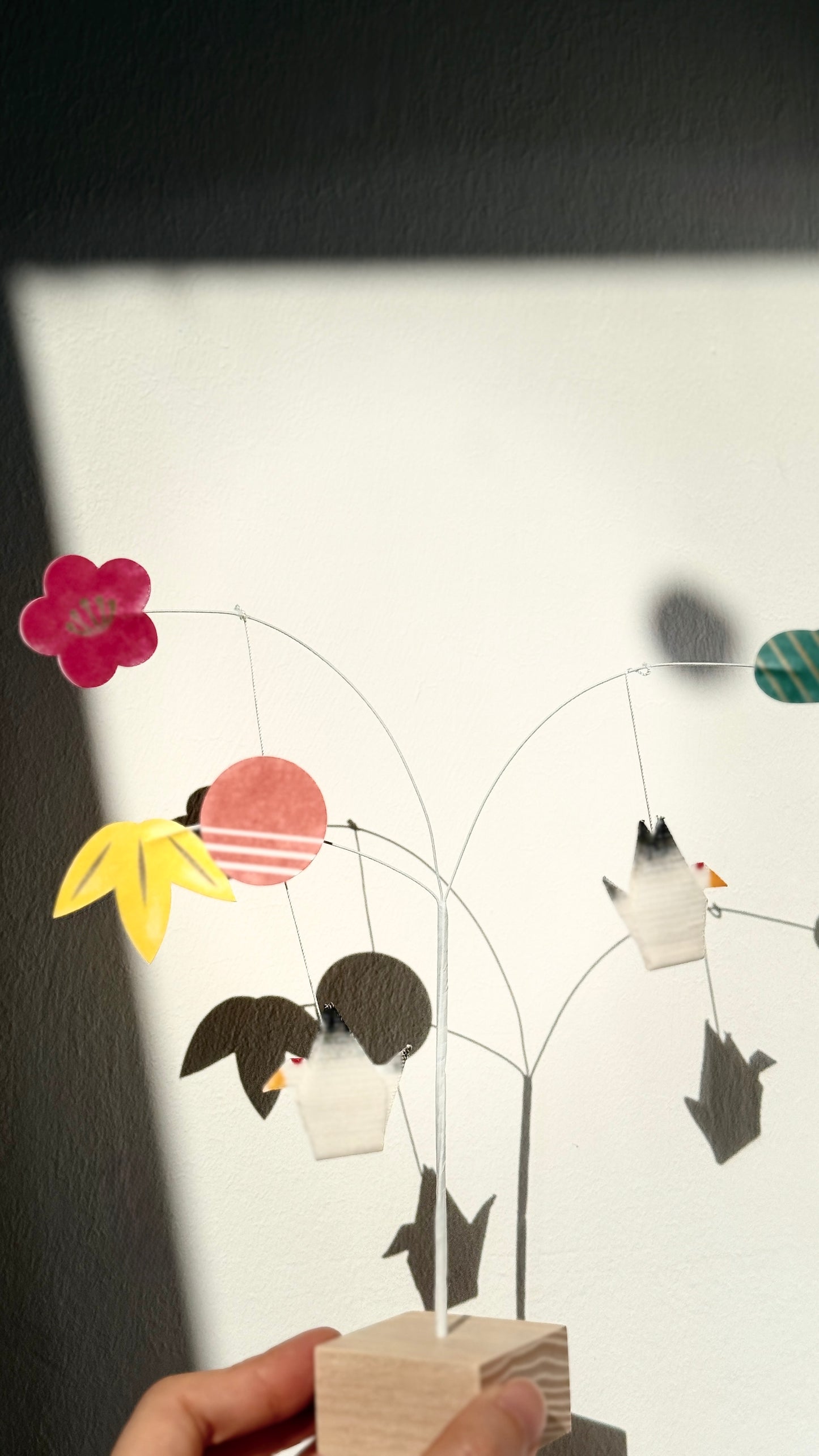 Decorative wall art with birds and flowers on a white background