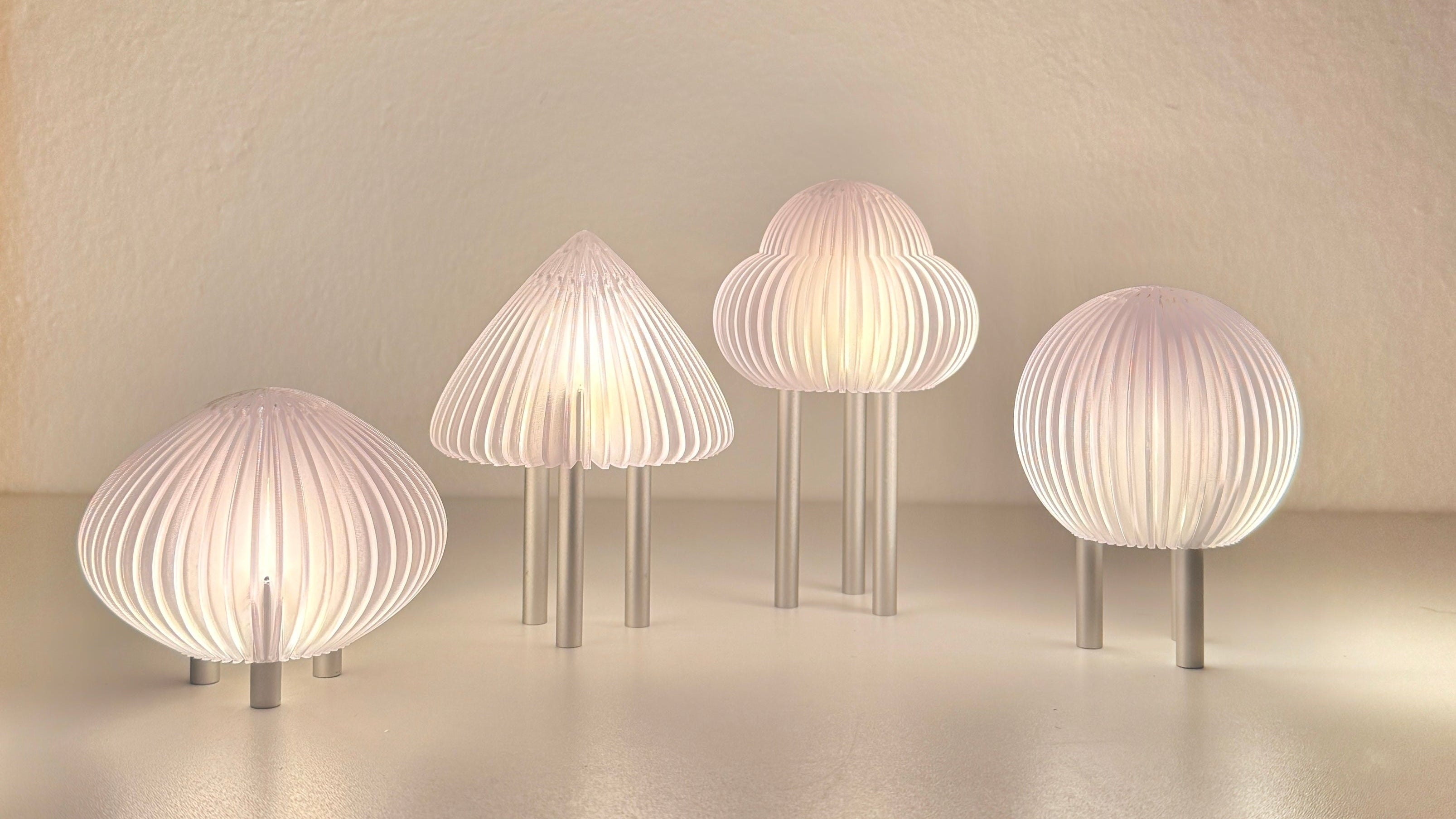 Set of five modern wall lights with ribbed design on a neutral background
