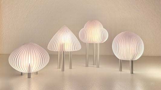 Set of five modern wall lights with ribbed design on a neutral background