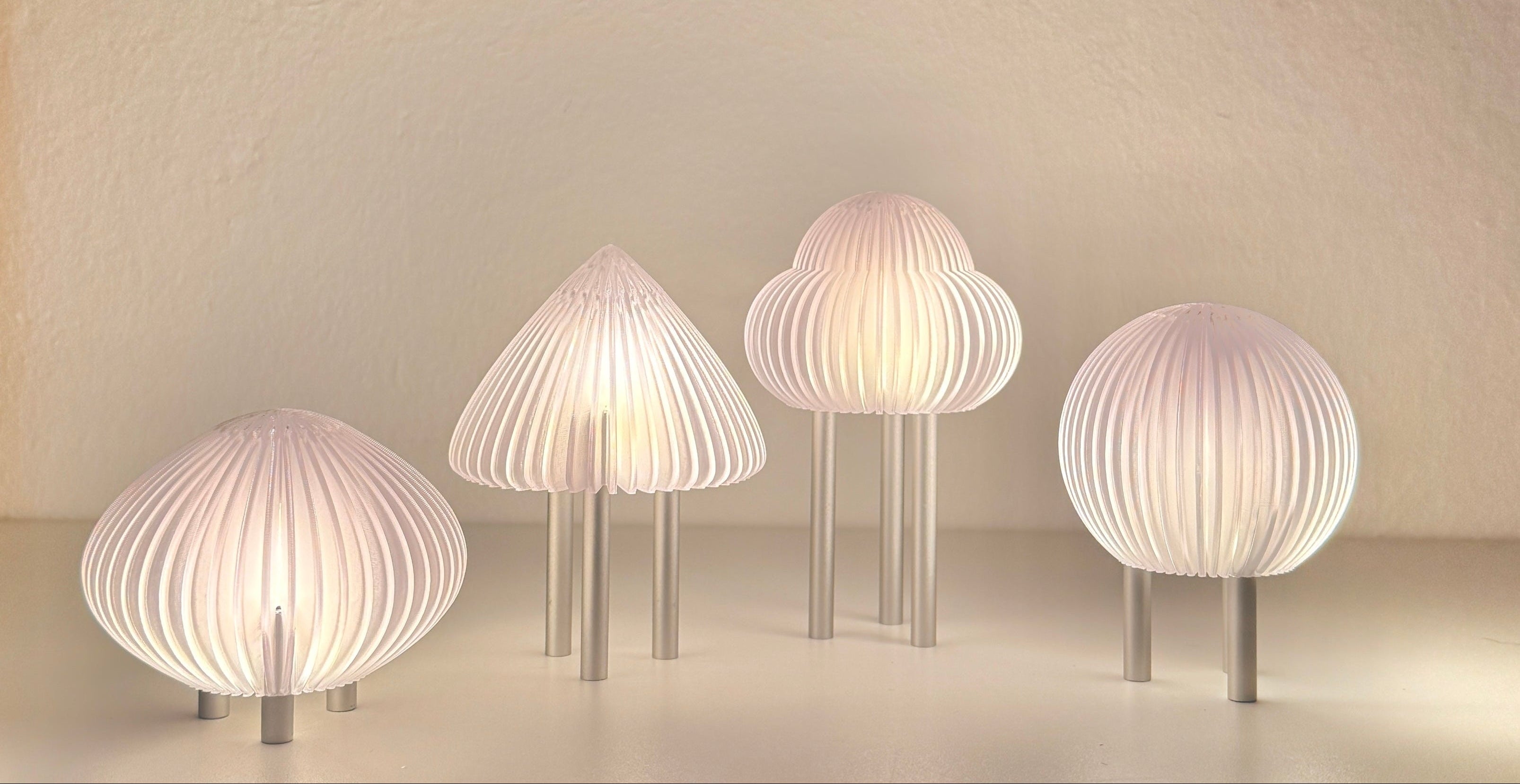 Set of five modern wall lights with ribbed design on a neutral background
