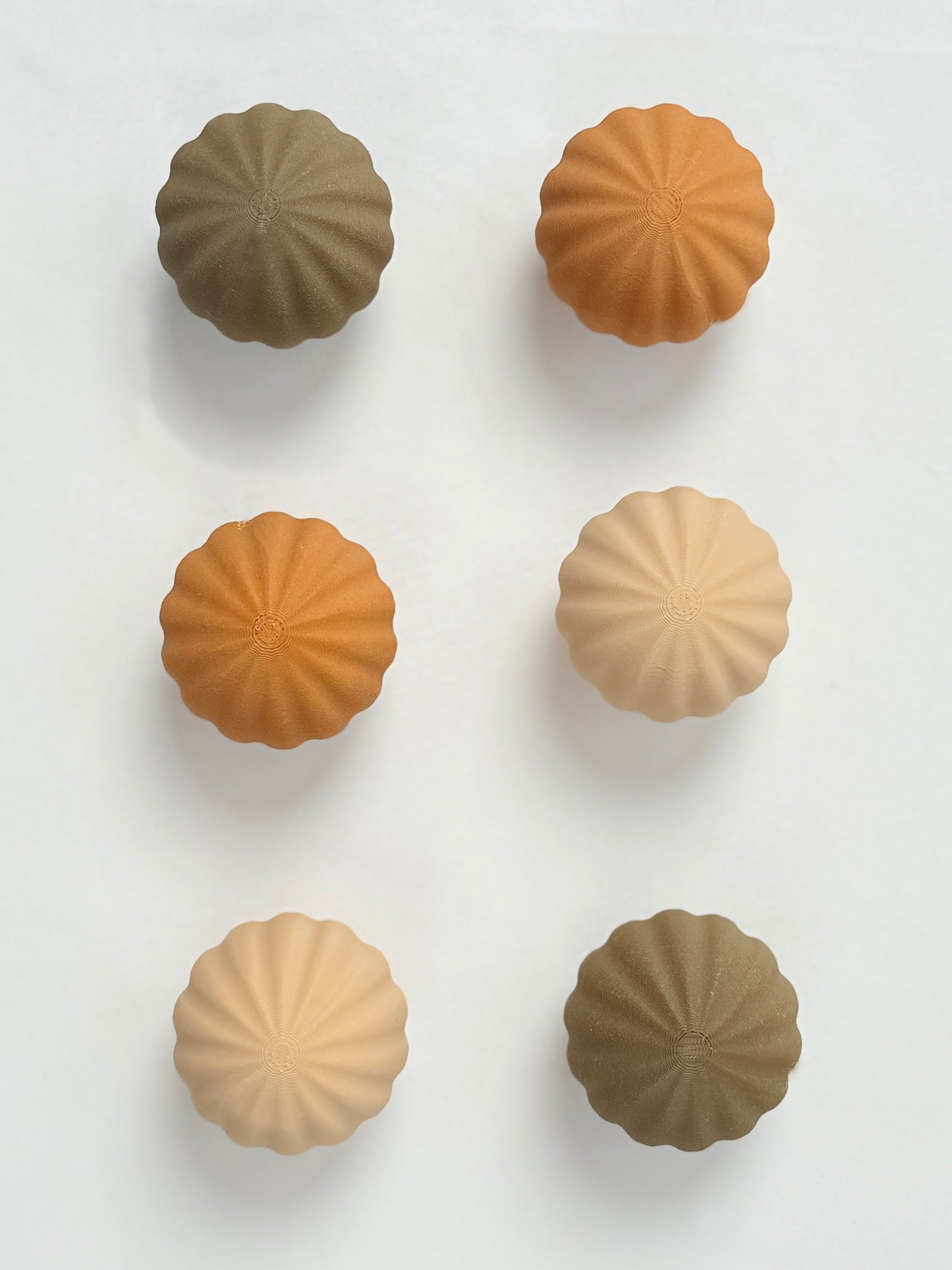 brown, beige, and dark brown colored spherical shaped Christmas ornament 
