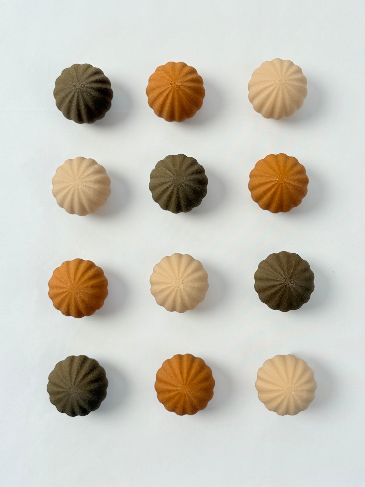 brown, beige, and dark brown colored spherical shaped Christmas ornament 
