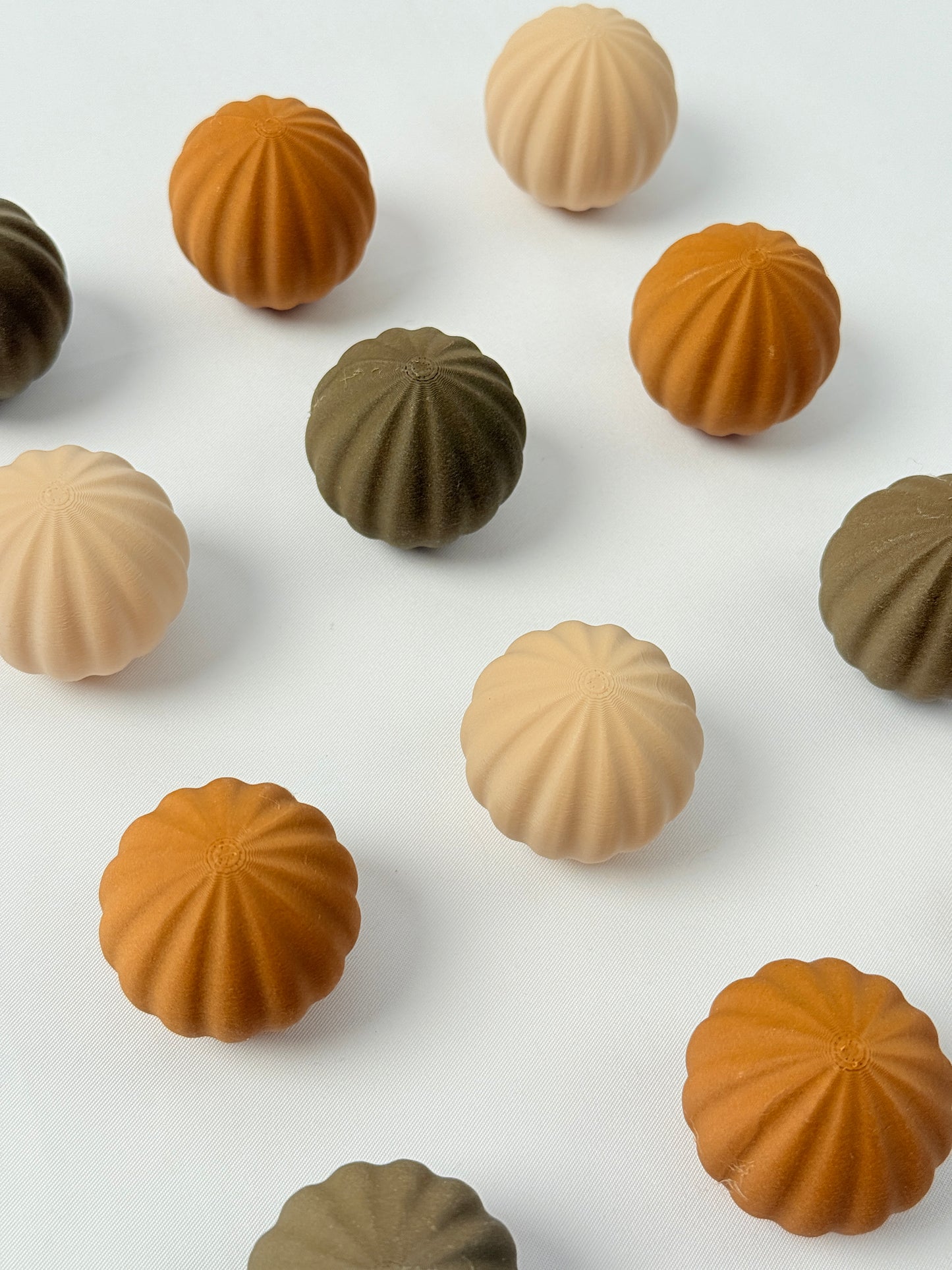 brown, beige, and dark brown colored spherical shaped Christmas ornament 
