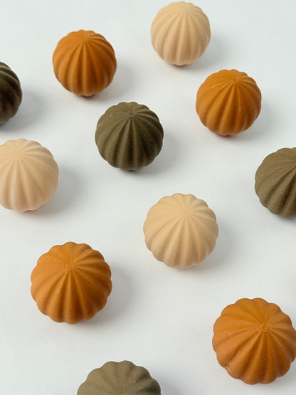 brown, beige, and dark brown colored spherical shaped Christmas ornament 
