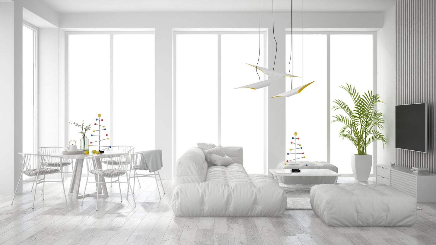 Modern living room with white furniture and decorate with colorful Christmas tree