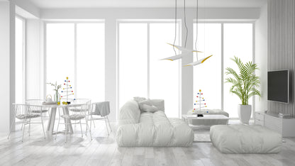 Modern living room with white furniture and decorate with colorful Christmas tree