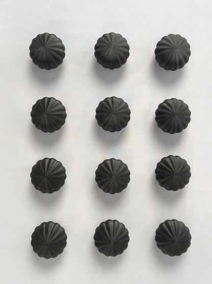 Black spherical shaped Christmas ornament 