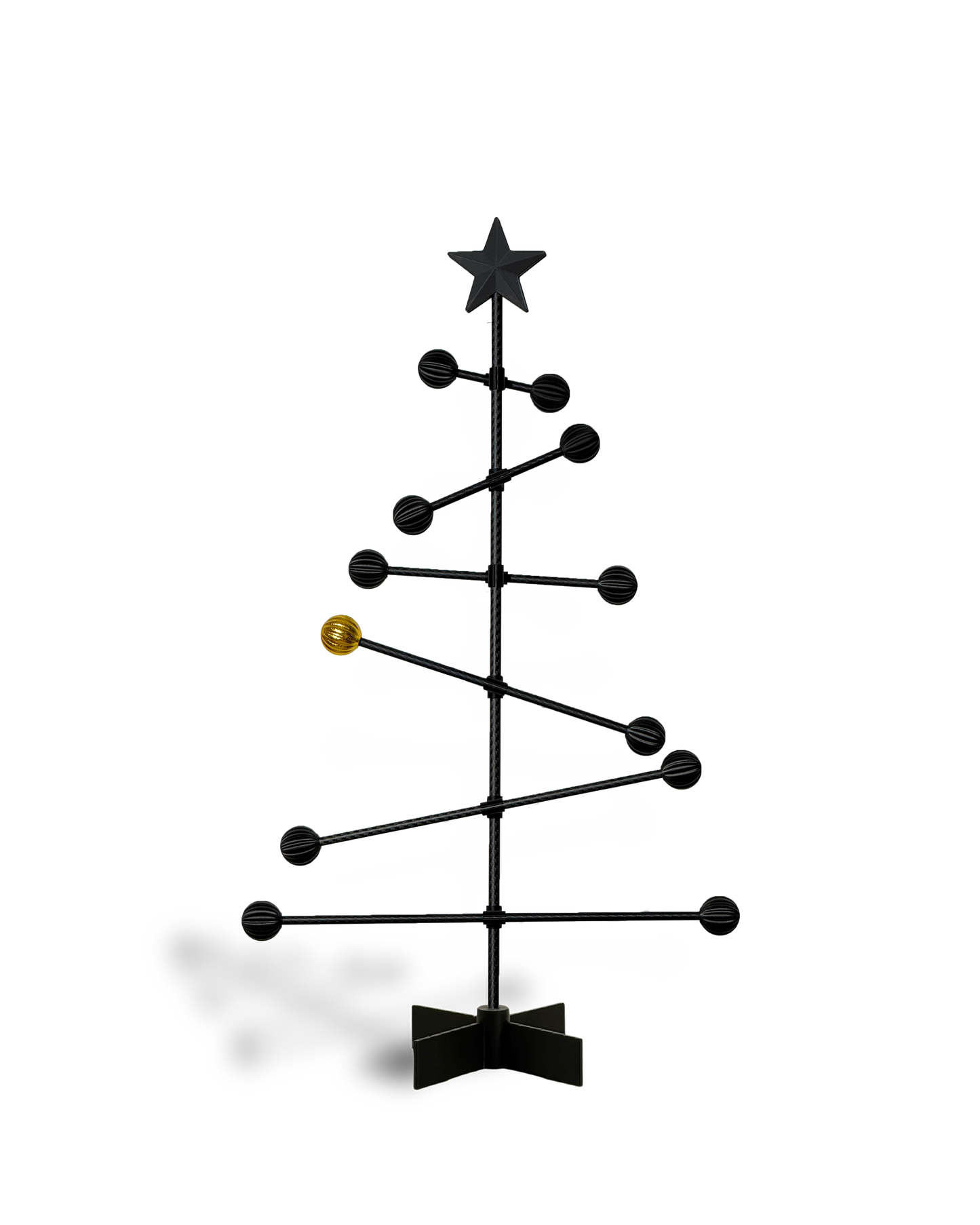 Black metal Christmas tree with star and a golden ball , on a white backgroundnd 