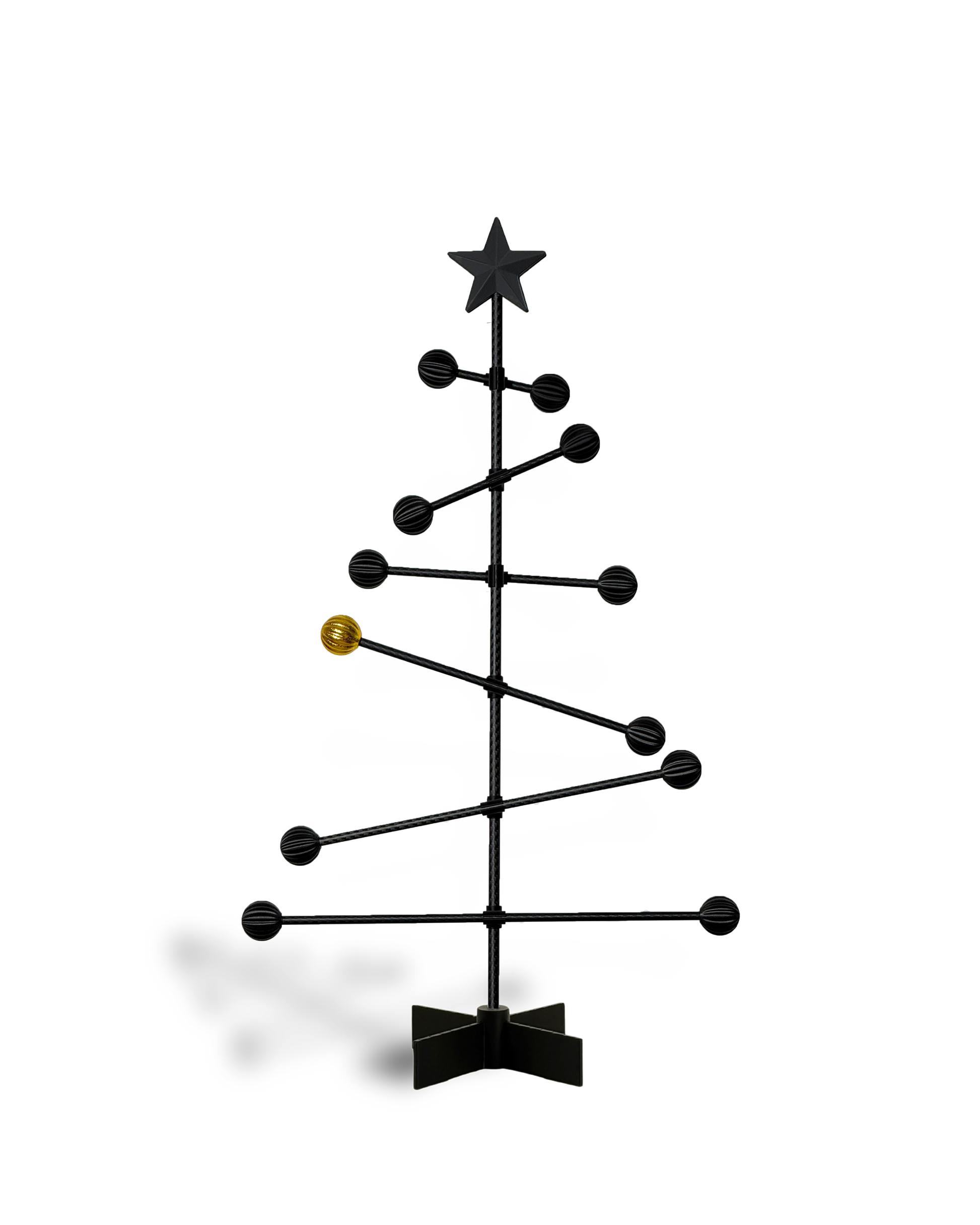 Black metal Christmas tree with star and a golden ball , on a white backgroundnd 