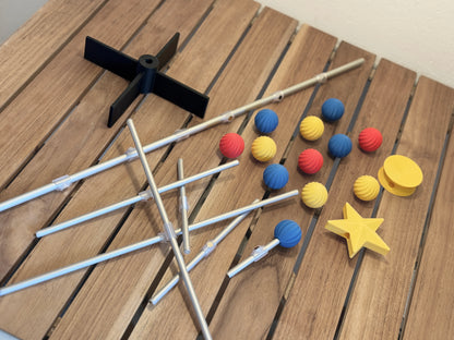 Modern modular for Bauhaus tree items including sticks, colorful ornament, and a star on a wooden surface