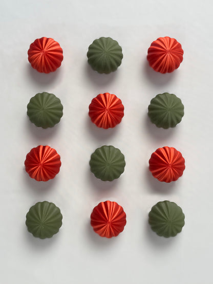 Red and green  colored spherical shaped Christmas ornament 