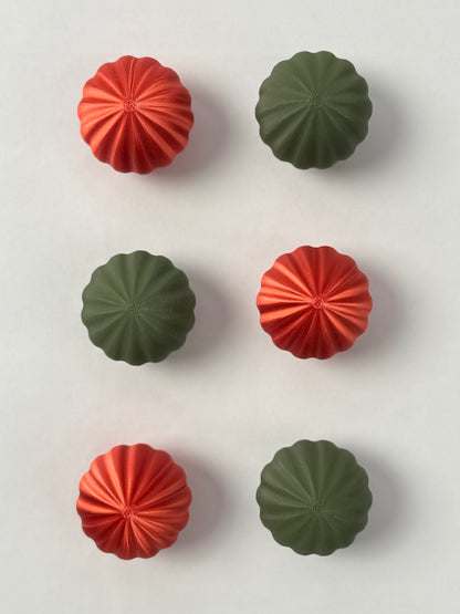 Red and green  colored spherical shaped Christmas ornament 
