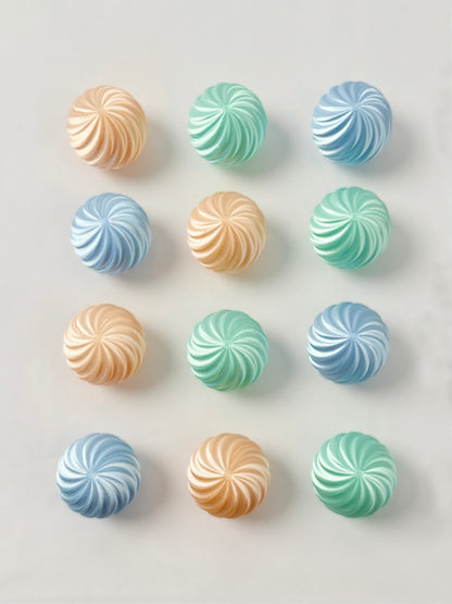Pastel green, baby blue and mint green colored spherical shaped Christmas ornament 