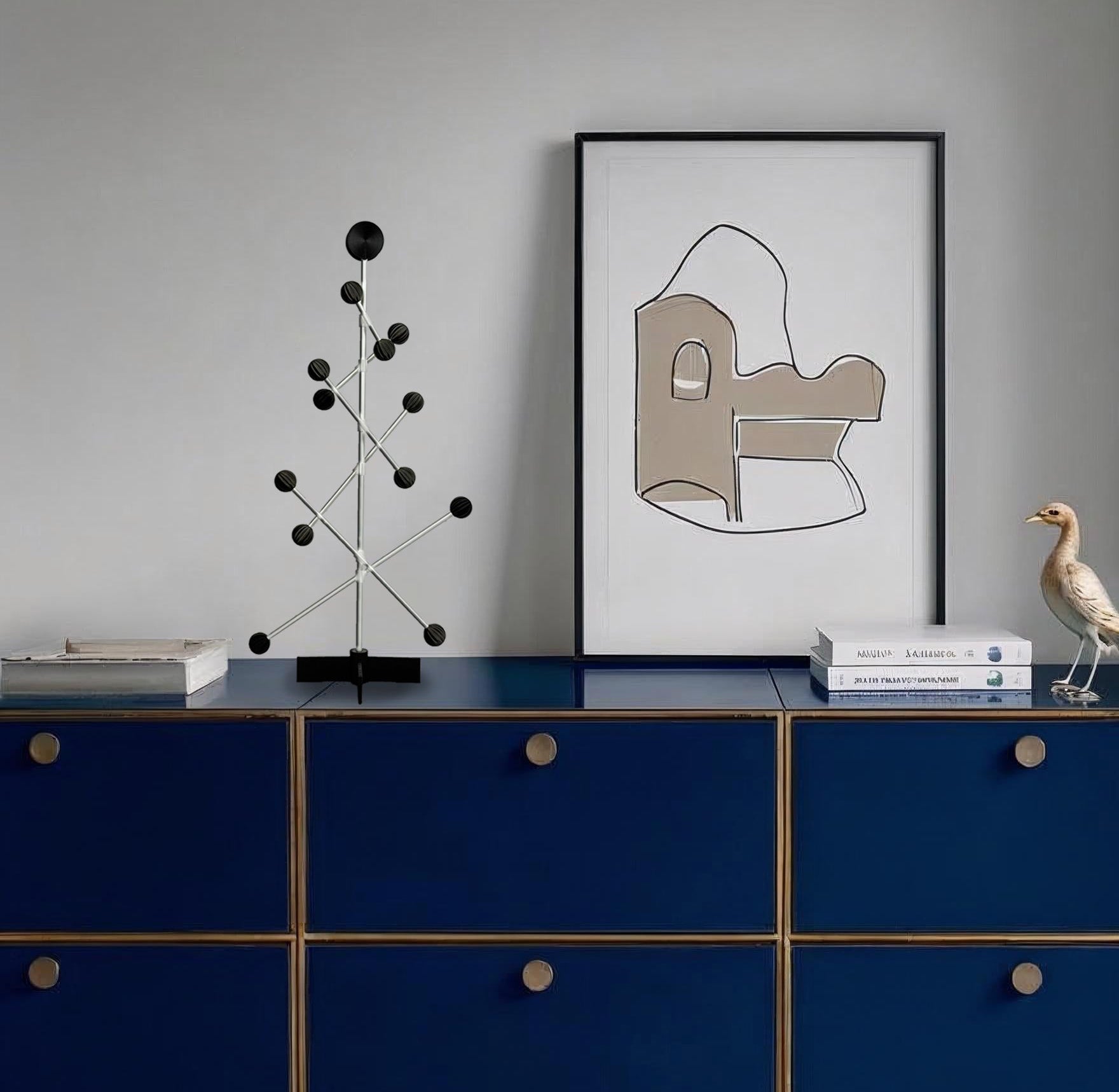 Modern interior with a blue dresser, abstract art, and decorative items.