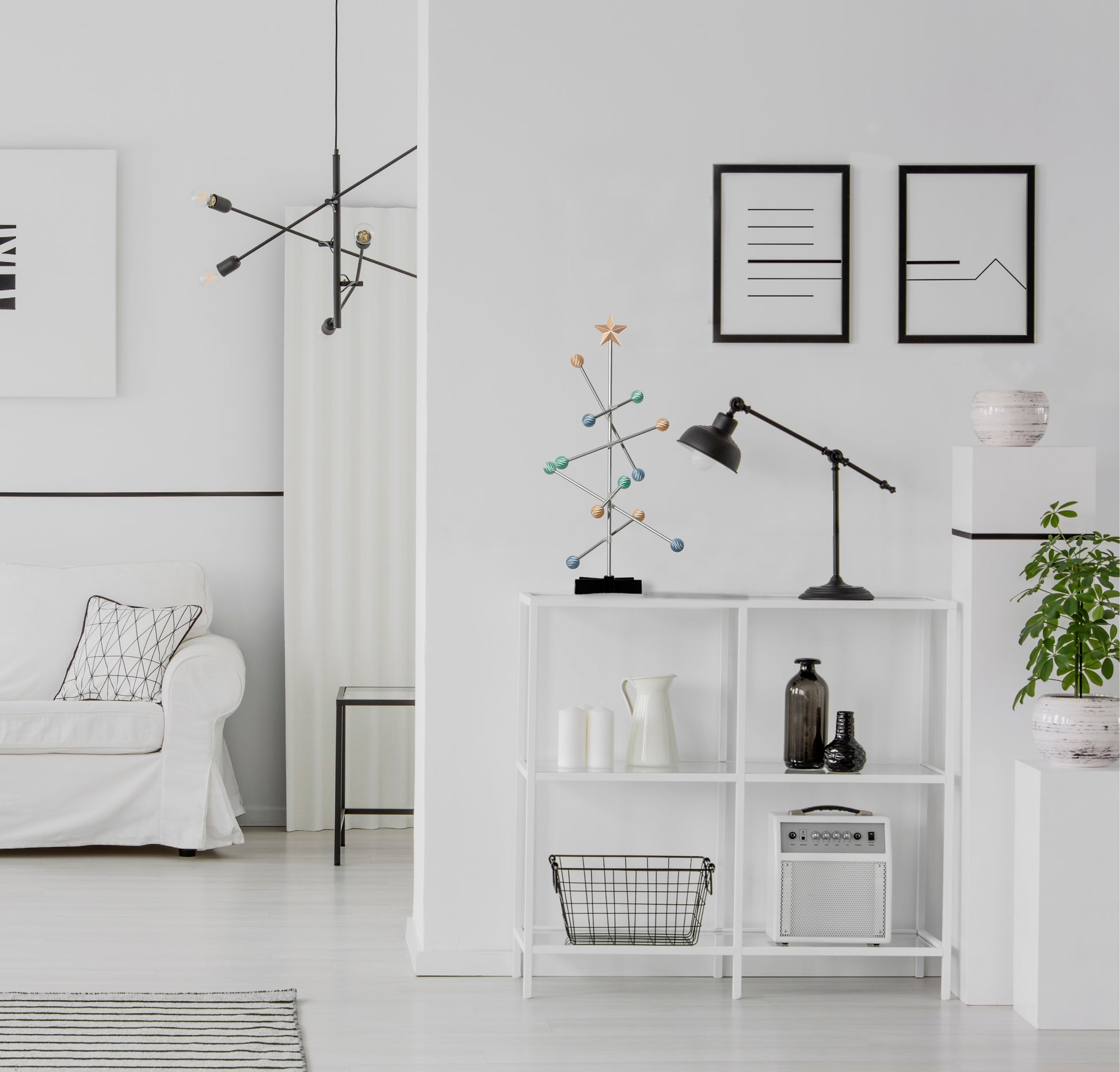 Modern living room with white bookshelf, decorative Modern modular  pastel easter colored tree.
