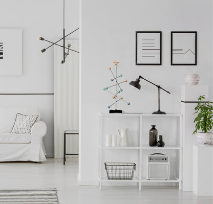 Modern living room with white bookshelf, decorative Modern modular  pastel easter colored tree.