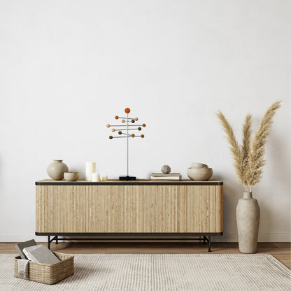 Wooden sideboard with wooden  decorative sculpture in a minimalistic room