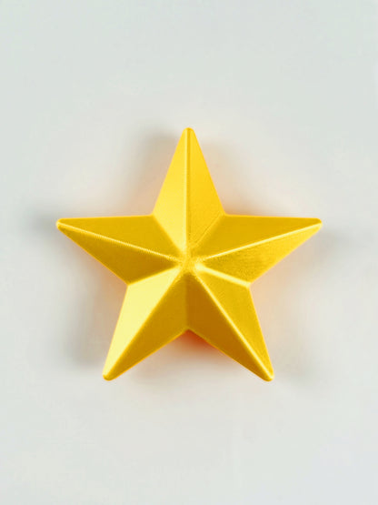 3D print Yellow star object/ ornament on a light gray background
